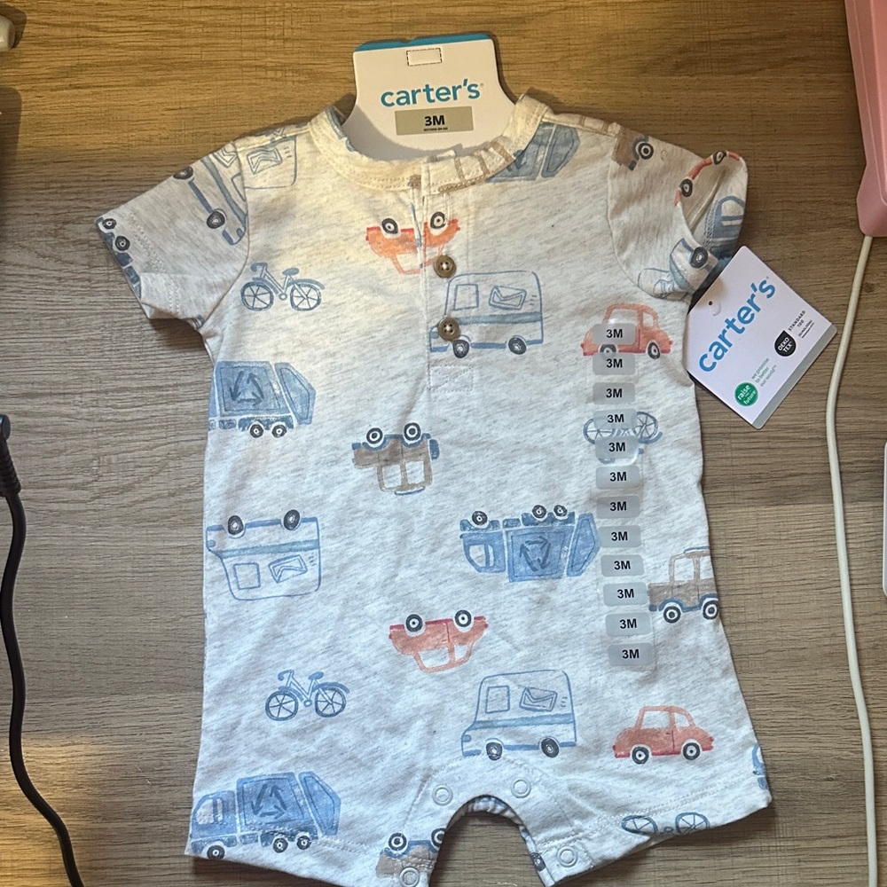 Carter's Cream Romper with Blue and Orange Vehicle Print